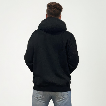 Person wearing a black hoodie from behind on a white background