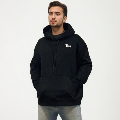 Man wearing a black hoodie with a logo on a white background