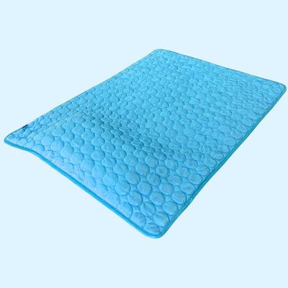 Blue cooling blanket reversed on a light blue background